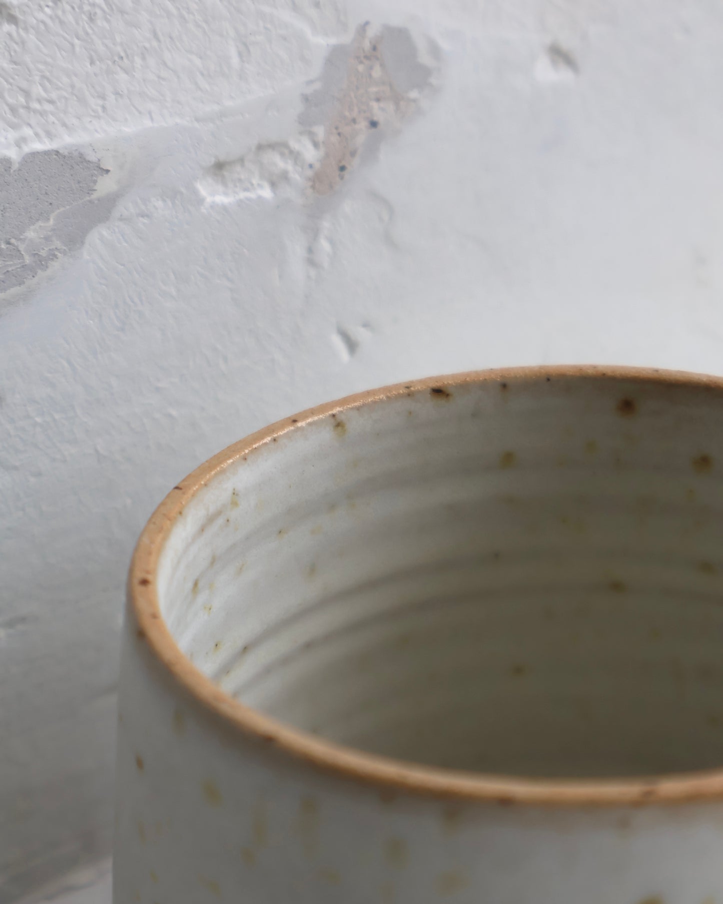 Handmade medium tapered ceramic cup in Dove glaze by Ela Grima.