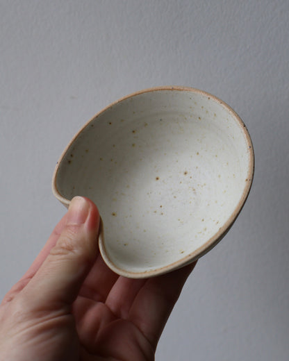 Handcrafted ceramic sushi bowl with matte creamy white glaze and integrated chopstick rest by Ela Grima