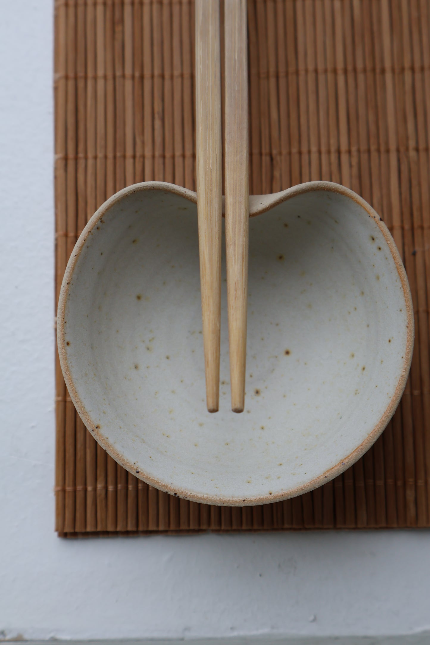 Top view of handmade ceramic sushi bowl showcasing minimalist design.