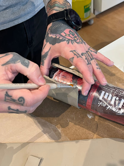 Participant shaping a mug using slab-building technique during ceramic workshop in Malmö with Ela Grima.